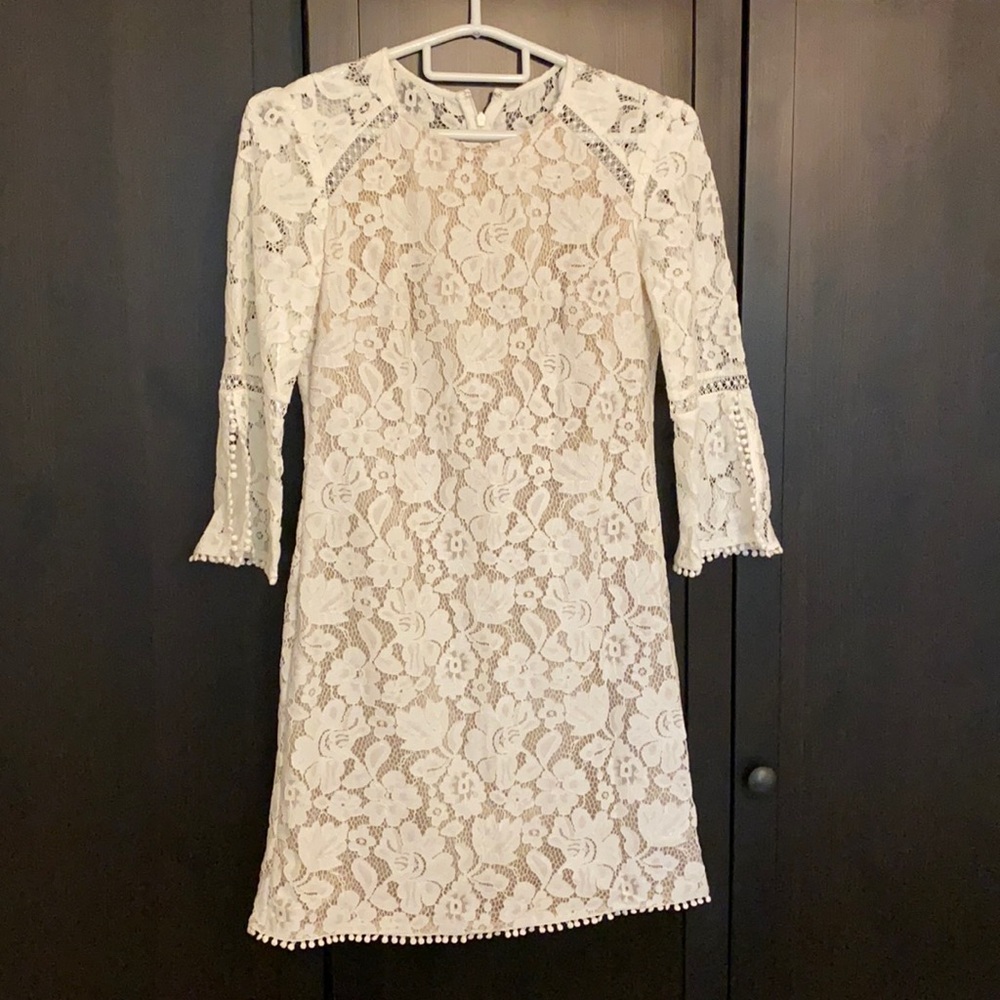 Long sleeve white lace dress.